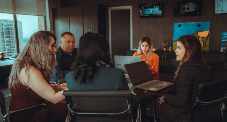 Game publisher office meeting laptops indie game concept