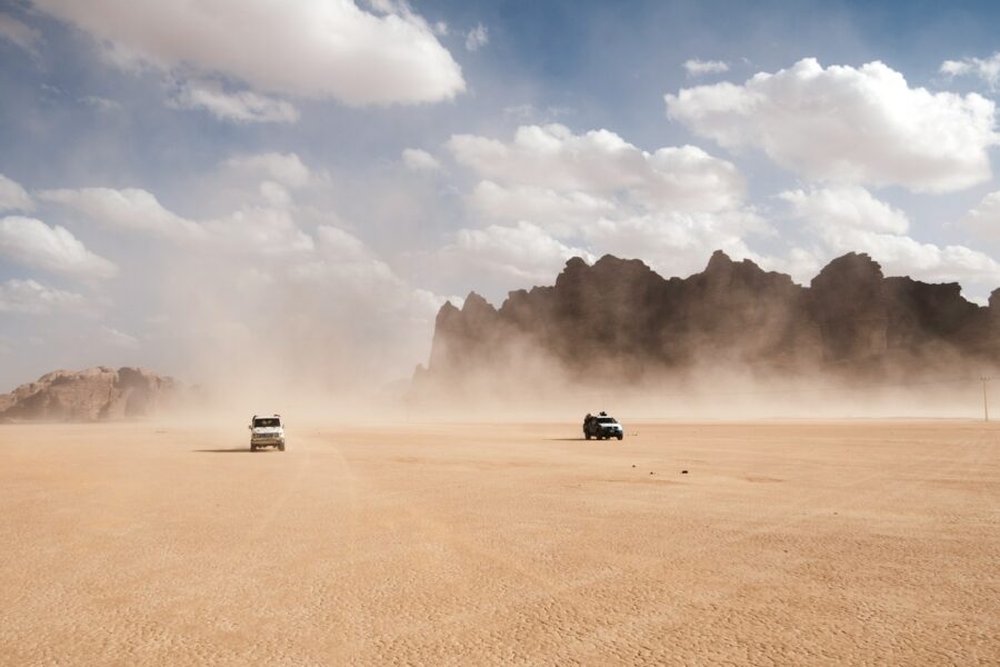 Cartoon desert battle cars explosion dust