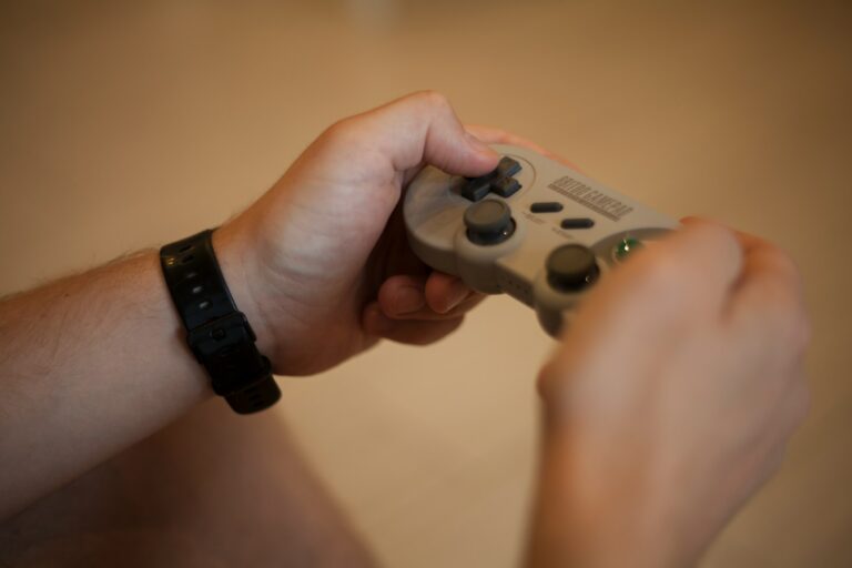 Hands holding gamepad sofa