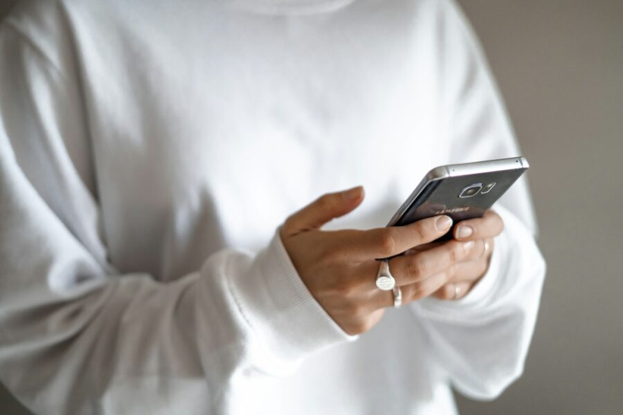 Teenager holding smartphone