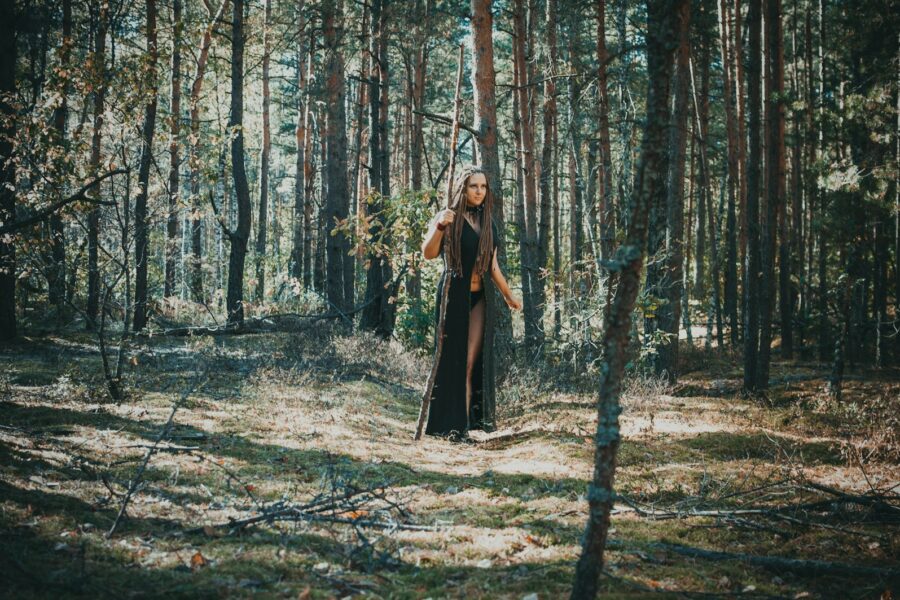 Fantasy rpg character holding sword forest